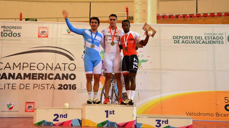 Kwesi Browne on podium after receiving bronze in the Keirin